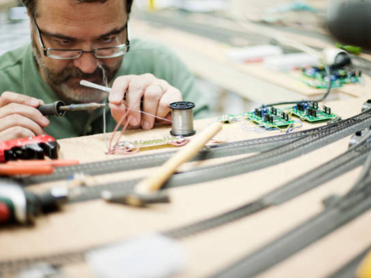 Model Engineer Soldering Train tracks